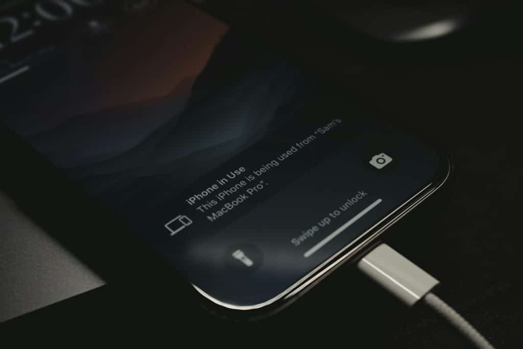 A close up of a cell phone charging